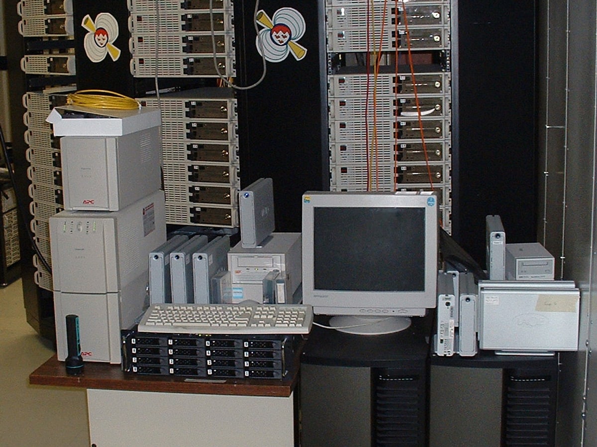 A real computer cluster with stacked servers and visible cabling.
