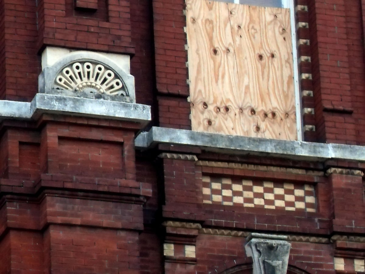 A real brick storefront with street-facing windows and entrance.